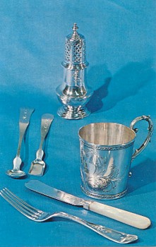 Featured is a postcard image of a display of antique Vermont-made silver in the permanent collection of The Bennington (VT) Museum.  The original unused postcard is for sale in The unltd.com Store. 